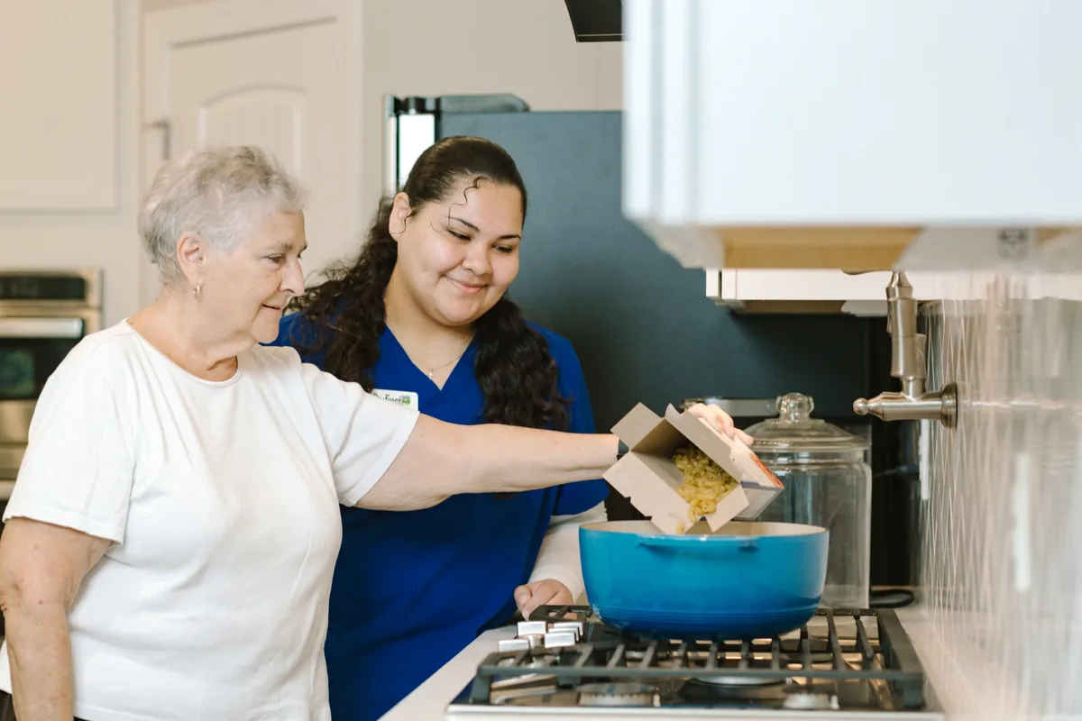 DayBreak caregiver providing supportive around-the-clock care for an older adult at home
