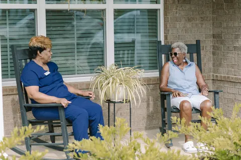 DayBreak caregiver sharing conversation with a client at home