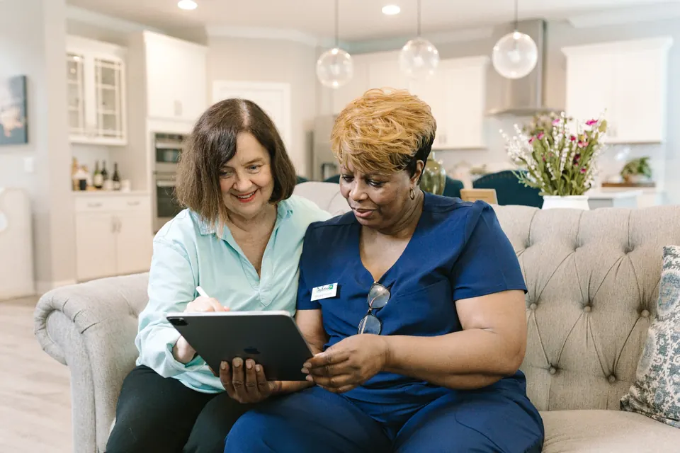 DayBreak caregiver spending one-on-one time with an adult client at home